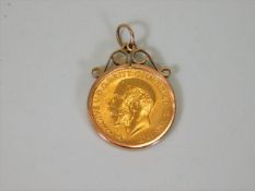 A George V full gold sovereign dated 1913 with 9ct