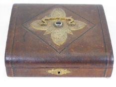 A c.1900 leather bound jewellery box with brass de