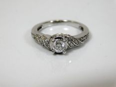 An 18ct white gold ladies ring with centre diamond