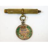 An 1893 enamelled sixpence with pencil