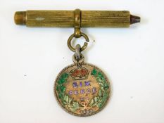 An 1893 enamelled sixpence with pencil