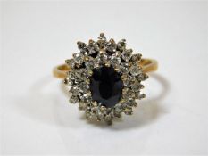 A 14ct diamond & sapphire ring with approx. 0.74ct