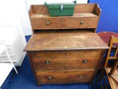 An oak chest with upper drawer