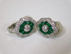 A pair of 18ct white gold diamond & emerald earrin
