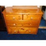 An antique pine chest of drawers