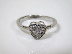 A 14ct white gold heart shaped ring with invisible