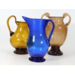 An American Bristol blue glass pitcher twinned wit