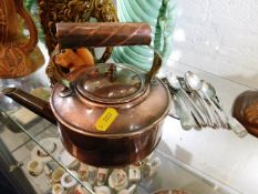 A small arts & crafts style copper kettle twinned