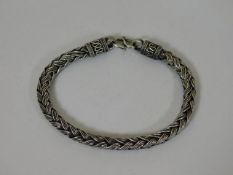 A woven white metal bracelet