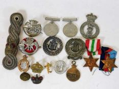 A quantity of medals, badges & other items
