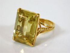 A yellow metal ring set with citrine stone 8.1g