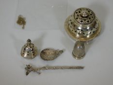 A silver sifter & other white metal items