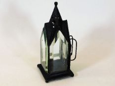 An early 20thC. gothic style candle holder lamp wi