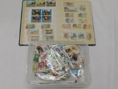 A horse themed stamp album & a box of mixed loose