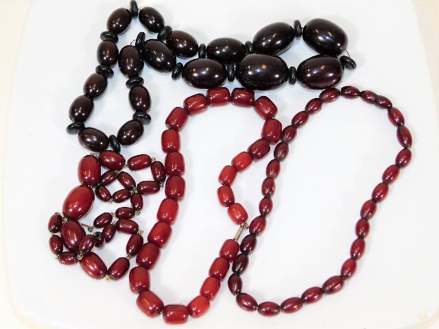 Four early 20thC. cherry amber style necklaces