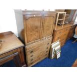 A two piece cabinet over chest