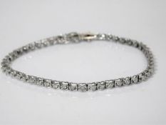An 18ct gold bracelet set with diamonds in heart s