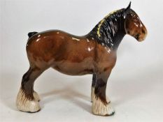A Beswick shire horse with yellow plait to the man