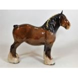 A Beswick shire horse with yellow plait to the man