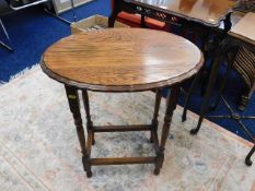 An oval oak occasional table