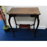 An Edwardian style mahogany occasional table with fretwork decor