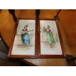 A pair of framed porcelain tiles