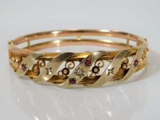 An antique yellow & rose gold bangle set with diam