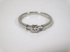 An art deco style 18ct white gold ring set with th