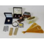 A silver pocket watch, a quantity of lighters & ot