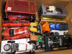 A box of model vehicles, some boxed