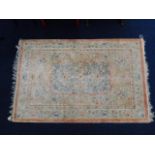 A Chinese woollen rug 73in x 48in
