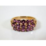 A 9ct gold ring set with pink stones 5g