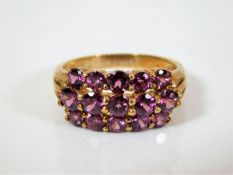A 9ct gold ring set with pink stones 5g