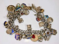 A substantial silver charm bracelet