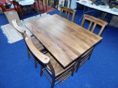 A farmhouse style trestle table with four chairs