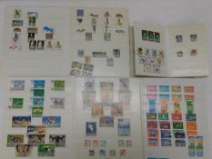 Four world stamp albums including some mint