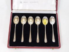 A set of silver spoons with case
