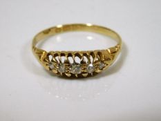 A Victorian 18ct gold ring set with five diamonds