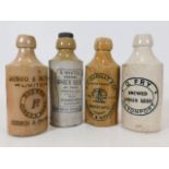 Four stoneware ginger beer bottles including Norwi