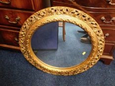 A gilt framed circular mirror