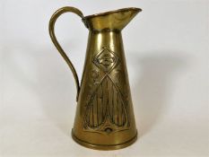 An art nouveau brass jug 8.75in high