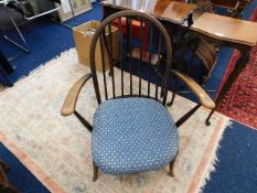 A low level vintage Ercol armchair