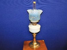 A Victorian oil lamp with 19thC. vaseline glass sh