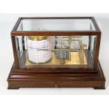 A Comitti barograph in mahogany & glass case, purc