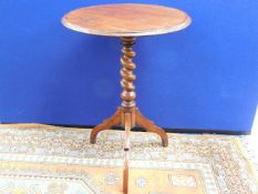 A Victorian wine table with walnut barley twist pe