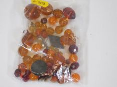 A quantity of amber & other beads