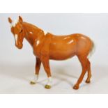 A Beswick Palomino horse facing left approx. 6.75i
