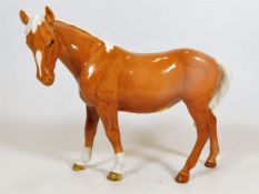 A Beswick Palomino horse facing left approx. 6.75i
