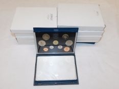 Ten cased proof UK coin sets