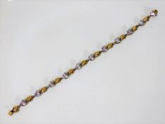 A 9ct gold bracelet set with lavender coloured sto